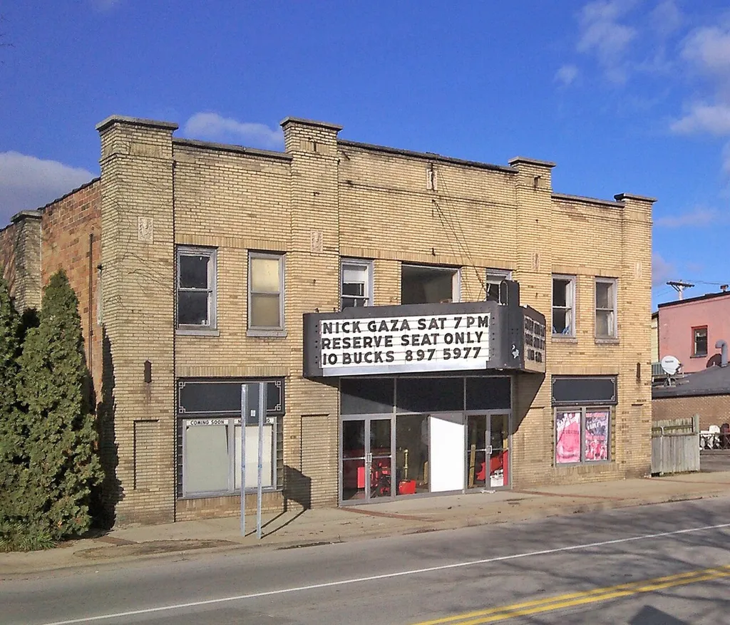 Strand Theatre, Lowell, Michigan. The Strand Theatre opened on June 12, 1928. It is on West Main at South Broadway and seated 502. It closed on December 2, 1985 with its last feature being “Back to the Future”. It has since been converted into a reception and catering center. They have kept it in its original decor inside with all the ornate features still intact and in use. The marquee has been stripped of its neon and painted but still utilizing the attraction panels.