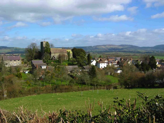 Wigmore Church and village View to the North east from Mortimer Trail Loop Walk showing dominant position of the church on the hill