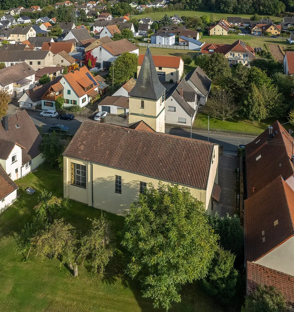Aerial view of Catholic Filial Church of the Exaltation of the Holy Cross in Schlammersdorf in the district of Forchheim