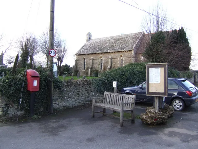 Littleworth, Vale of White Horse, Oxfordshire: the Church of England parish church of St Leonard, with a post box, a bench and a parish notice board.