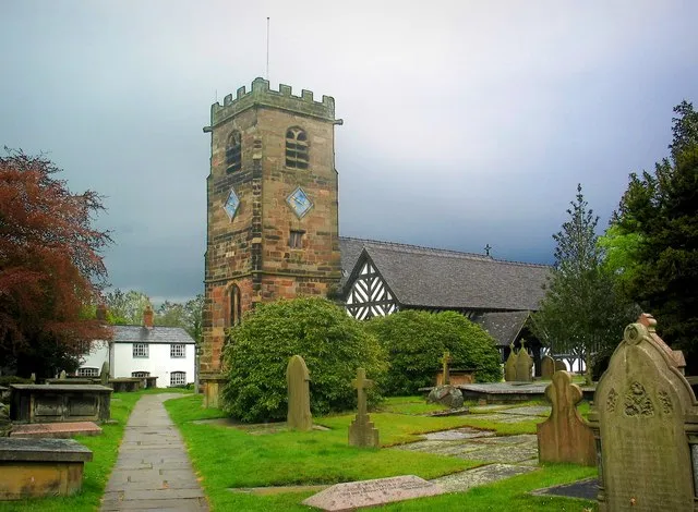 Church at Lower Peover : The body of the church with its black and white timbering dates from the 14th century. The Perpendicular stone tower is a later addition, built in 1582.