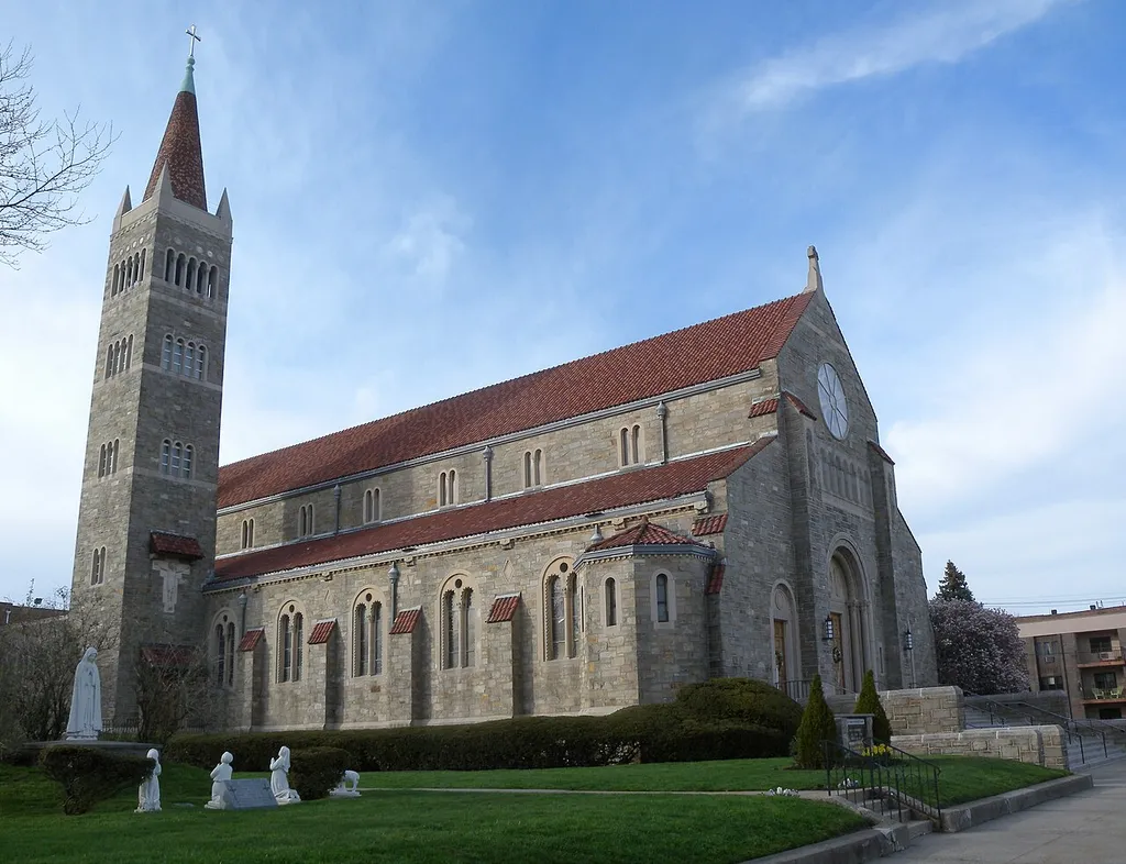 Looking north from Avenue C and 46th Street at St Vincents de Paul Roman Catholic Church on a sunny afternoon. Designed by Maginnis &amp; Walsh.