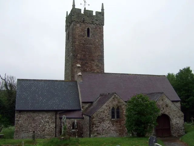 St Decuman's, Rhoscrowther A large cruciform mediaeval church which now stands alone, almost the sole survivor of the deserted village of Rhoscrowther. Supposedly founded by St Decuman(us) or Degman, an early Christian saint who was born here and crossed the Severn in a coracle to Somerset where, in Watchet, is the only other church dedicated to him. It is thought that his cell that once formed part of the church; there is also St Degman's well not far away. The earliest parts of the church go back to C13/14. It was restored twice in the C19 and again in 1910. Services are still held for the exiled villagers.