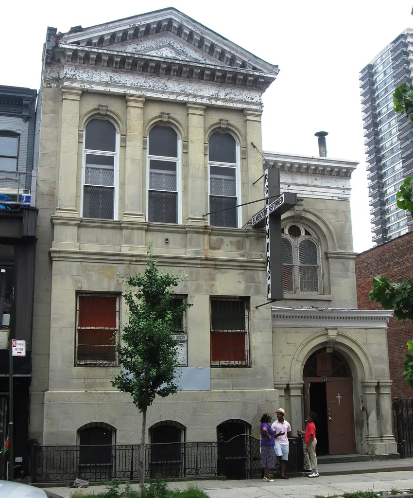 The Elmendorf Reformed Church at 171 East 121st Street between Sylvan Court and Third Avenue in the Harlem neighborhood of Manhattan, New York City was founded as a parish house and Sunday school for the First Collegiate Church of Harlem, which had its beginnings in 1660 as the Harlem Reformed Dutch Church. Sanctuaries were built in 1665-67, 1686-87, 1825 and 1897, at various locations in the area. In 1893-94 a Neoclassical parish house was built, designed by Joseph Ireland, and c.1910 the church at the time was torn down, and the parish house was rebuilt as the Elmendorf Chapel, which now stands as the Elmendorf Reformed Church, the oldest congregation in Harlem. (Sources: From Abyssinian to Zion and AIA Guide to NYC (5th ed.))