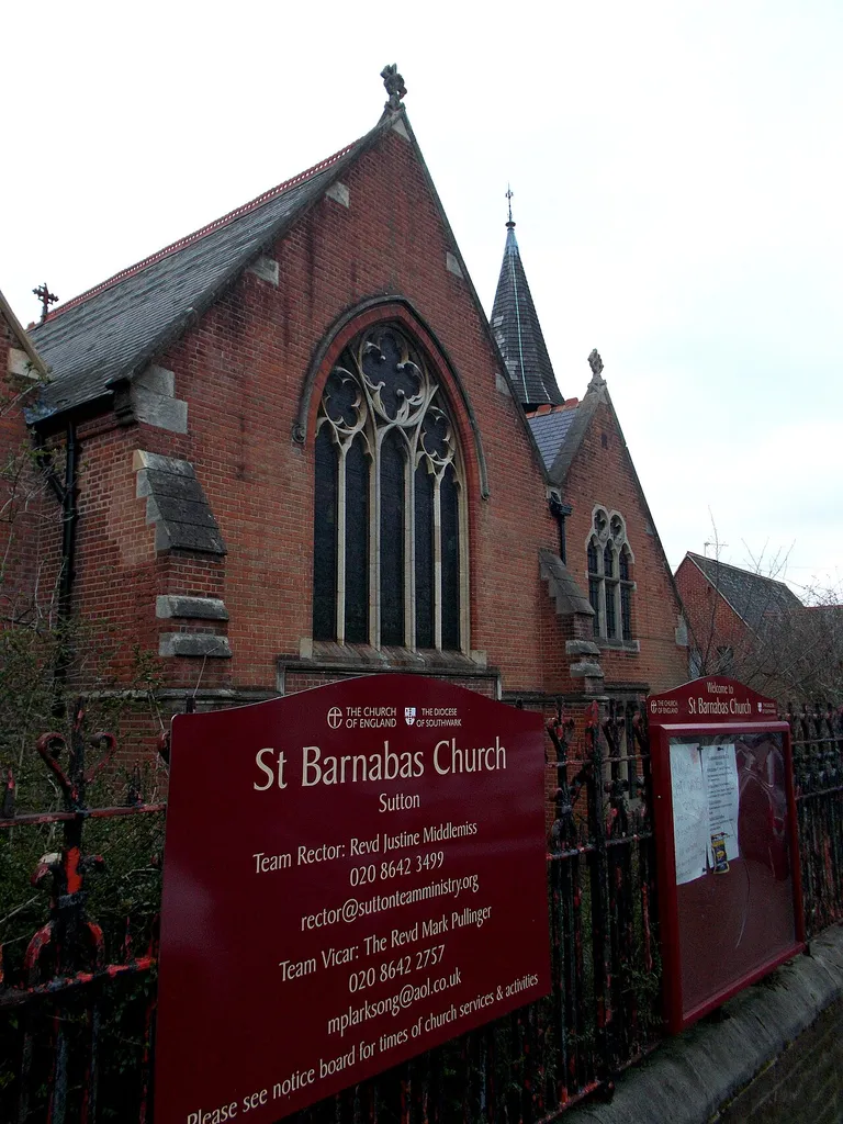To the east of Sutton town centre is St Barnabas Church, which was built between 1882 and 1884 by architects R H Carpenter and Benjamin Ingelow. Its purpose was to serve the Newtown area of Sutton, which was developed in the second half of the 19th Century. Architecturally, it is a red brick building with stone dressings, and is in the Gothic Revival style. Its nave has five bays, and is supported inside by columns with clustered shafts and a timber scissors truss roof.