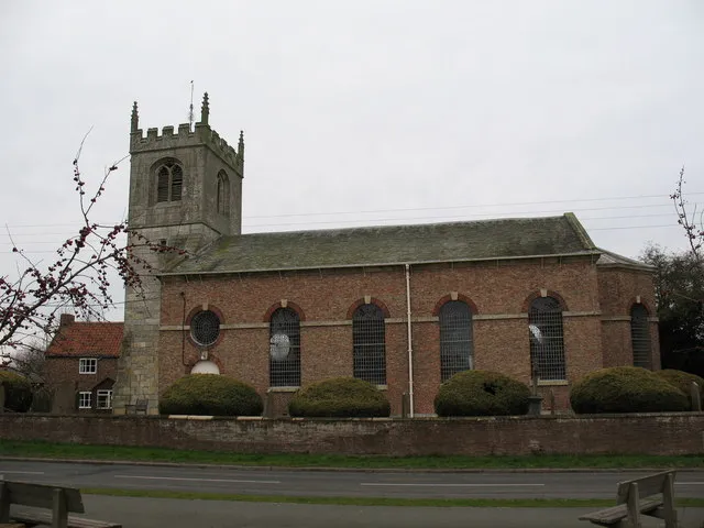 St Helen's Church Wheldrake An unusual church with a mostly 14th century stone tower and an attractive brick nave and chancel of 1778-9 with clear Georgian windows.