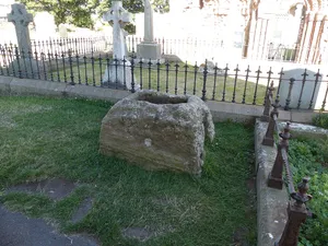 Cross base c.5 yards east of Church of St Mary