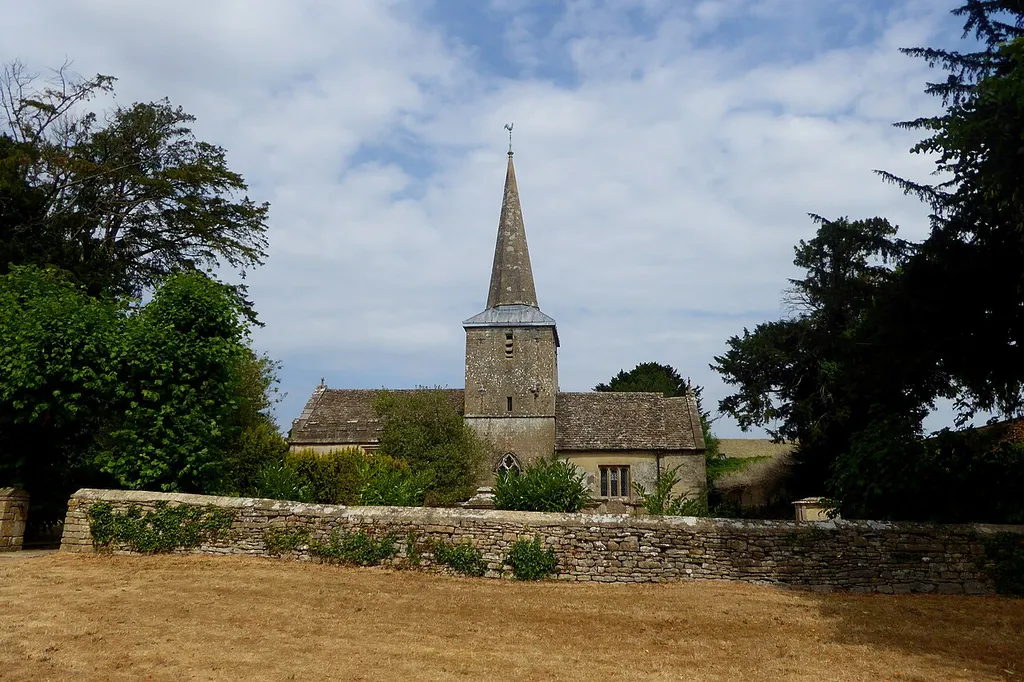 St Peter's Church in Rodmarton, as seen from the adjacent road. This is a photo of listed building number 1089236.