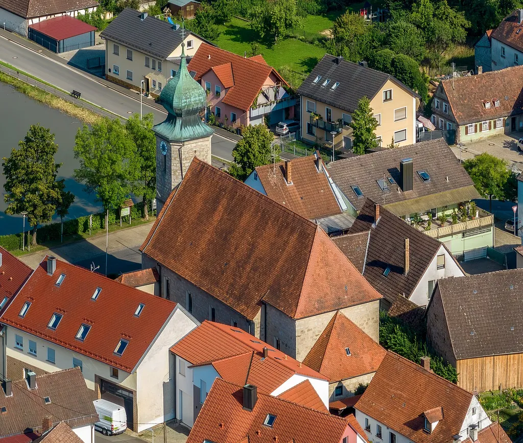 Catholic Church of the Assumption in Aschbach, aerial view.