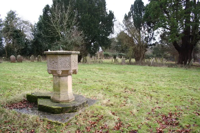 15th-century Perpendicular Gothic baptismal font in the churchyard of the former parish church of St Edith, South Reston, Lincolnshire. A Gothic Revival church on this site was designed by James Fowler, built in 1864–65 and demolished in 1983.