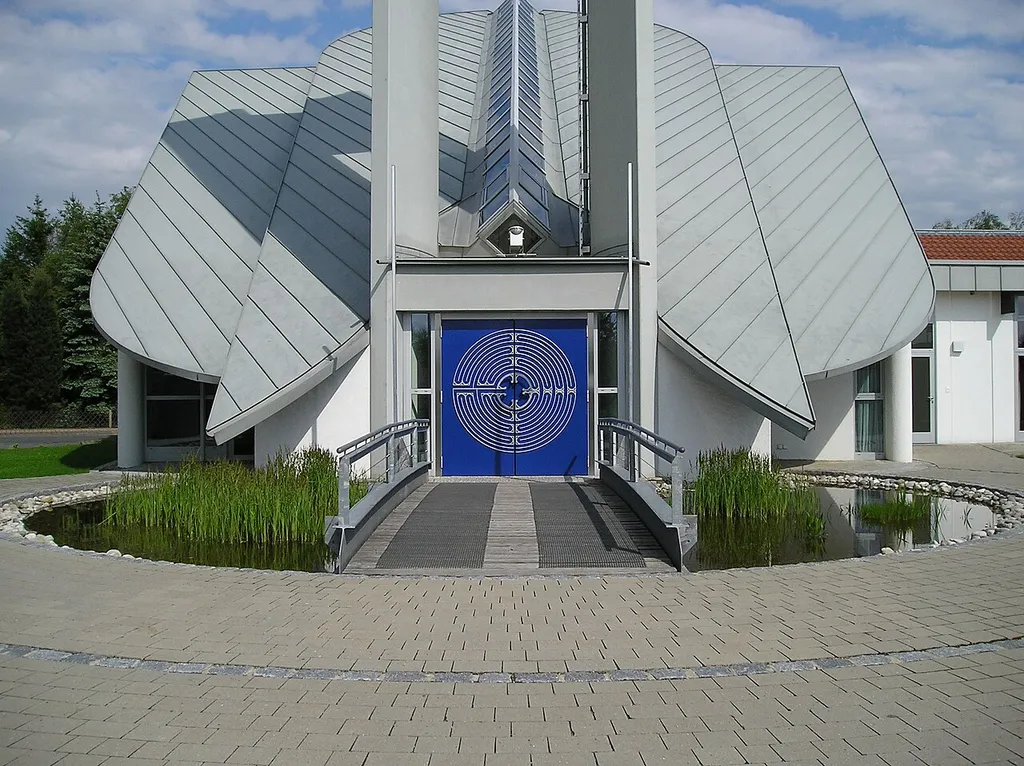 The Christuskirche (Lutheran curch) in Neunkirchen am Brand (Bavaria, Germany) viewed from the front towards the entry portal. On top of the two pylons outside the image there is the top of the bell tower.