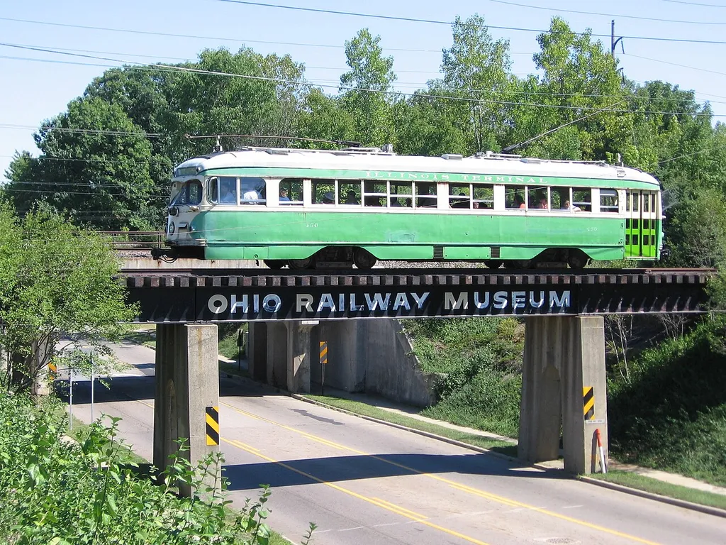 Ex-Illinois Terminal Railroad car 450, a 1949 double-ended PCC streetcar, at the Ohio Railway Museum, in Worthington, Ohio. It is crossing over Dublin-Granville Road.