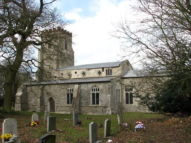 St Mary's church. View across churchyard, from the south. Located beside the River Wissey, St Mary's church has a massive buttressed 15th century tower and aisles that were built to each side of it; the south porch is two storeys high. Extensive repairs were carried out during the 19th century > 709940; a medieval stone mensa has survived and still functions as an altar table > 709951. St Mary's church is no longer used for worship and presently in the care of the Churches Conservation Trust. The church is kept locked but a key is available. For more information see: http://www.norfolkchurches.co.uk/eastbradenham/eastbradenham.htm