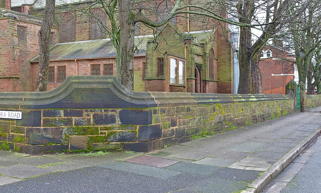 The wall of the churchyard of Old Christ Church with chamfered copings, south along Waterloo Road from Alexandra Road