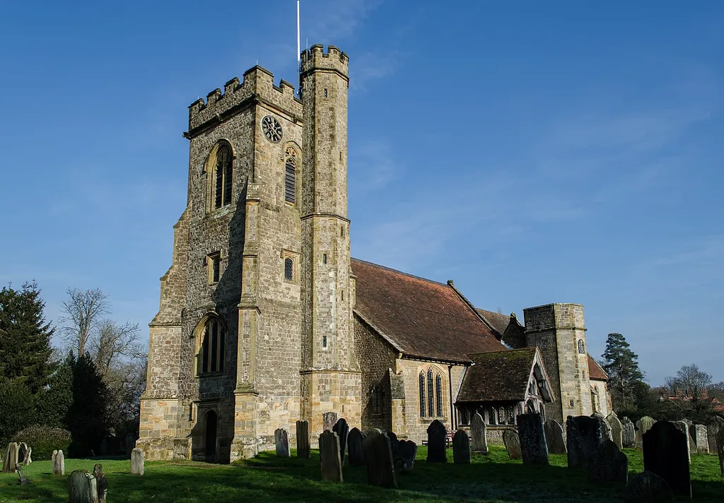 Grade II* listed. The church consists of a west tower of four stages dating from the 15th century, although only 9 feet of the tower was originally built and a timber Belfry was erected. It was finished in the 19th century. There is a 13th century tower arch, and a separate turret with spiral staircase. The tower has six bells. There was originally a gallery in the tower which was removed in the 19th century. The nave has a three bay arcade to the south aisle, the north wall dates from the early 16th century following a fire in which the north aisle was destroyed. The remains of a 13th century pillar can still be seen with the original red stencilling. The chancel has a 14th century three Bay arcade to the south Chapel which now contains the organ from 1879. The church was restored in 1860 when a turret was added to the chancel, and circa 1890 when the chancel was remodelled. The church contains several Ledger stones and a brass inscription which dates from 1407. On the north wall there is a brass from C.1580 showing an open coffin and Angel blowing a trumpet. There is an octagonal perpendicular font with floral motifs and grotesque masks. The pulpit dates from the 17th century. Most of the stained glass is 19th C.