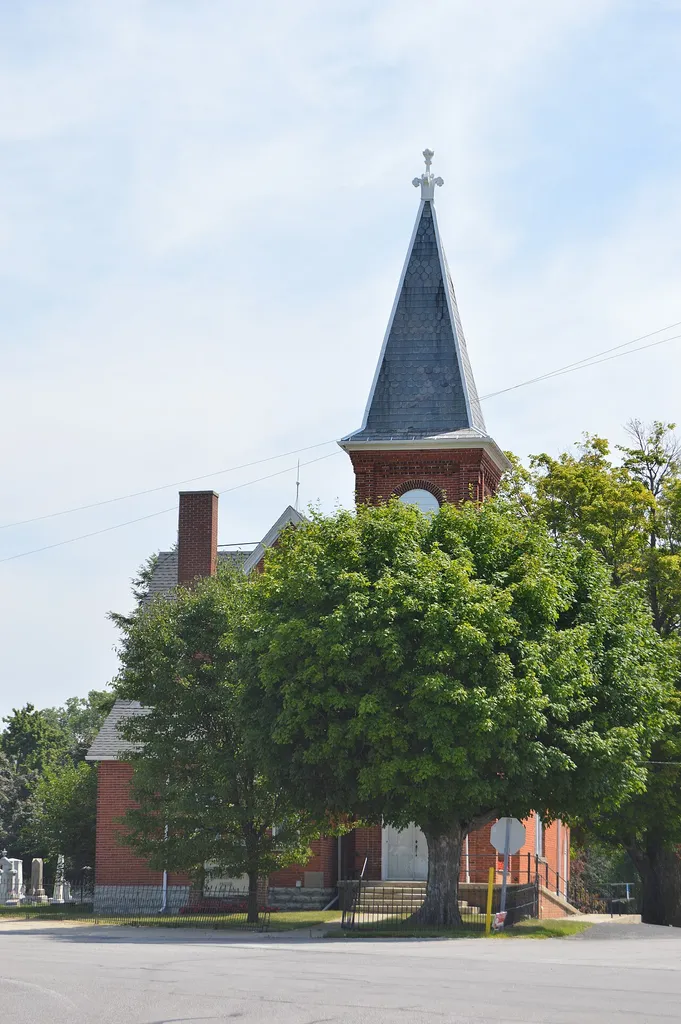 Roadside view of the front of Pleasant Ridge United Methodist Church, located at 3721 State Route 101 northeast of Tiffin in Pleasant Township, Seneca County, Ohio, United States. Built in 1890, it is listed on the National Register of Historic Places.