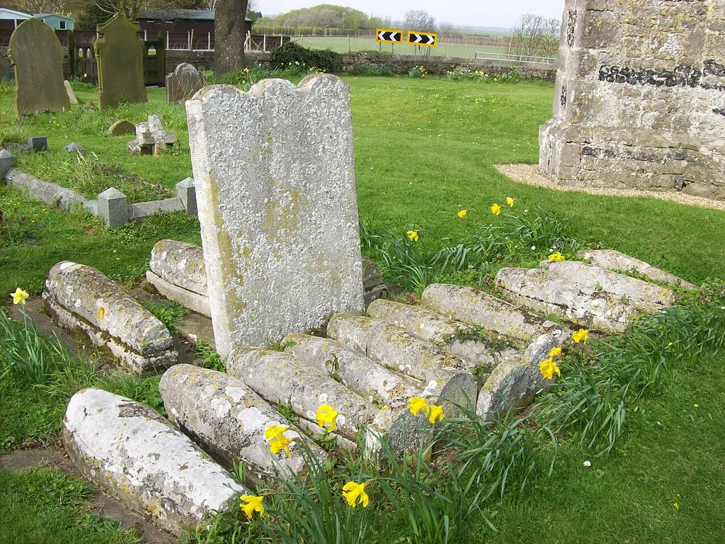 "Pip's Graves" in St James' parish churchyard, Cooling, Kent. Graves of 13 members of the Comport and Baker families, all or most of them children. This is supposedly the inspiration for the graves of Pip's brothers in Charles Dickens' novel Great Expectations.