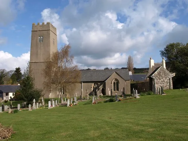 St Bartholomew's church, Coffinswell The "austere W tower with ... a strong batter ... now dark roughcast" (Cherry &amp; Pevsner) is the earliest part of this church at the south-east edge of the village.