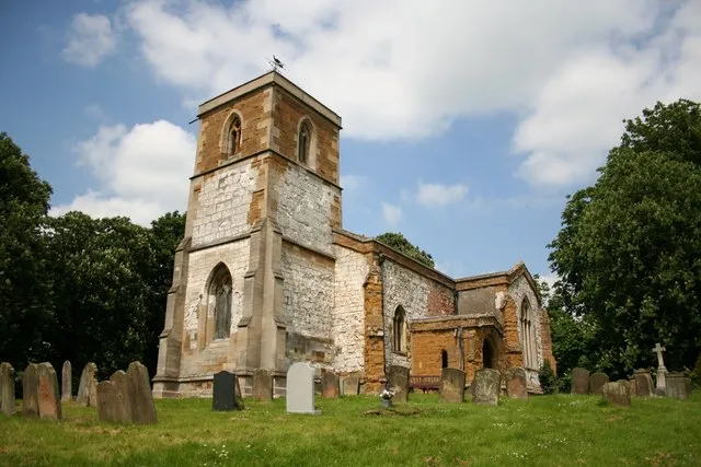 St.Andrew's, Utterby, Lincs. Of ironstone, chalk and a bit of brick, St.Andrew's church is largely 14th century with some architectural oddities, including a splendid south door and a novel drainage system for the font.