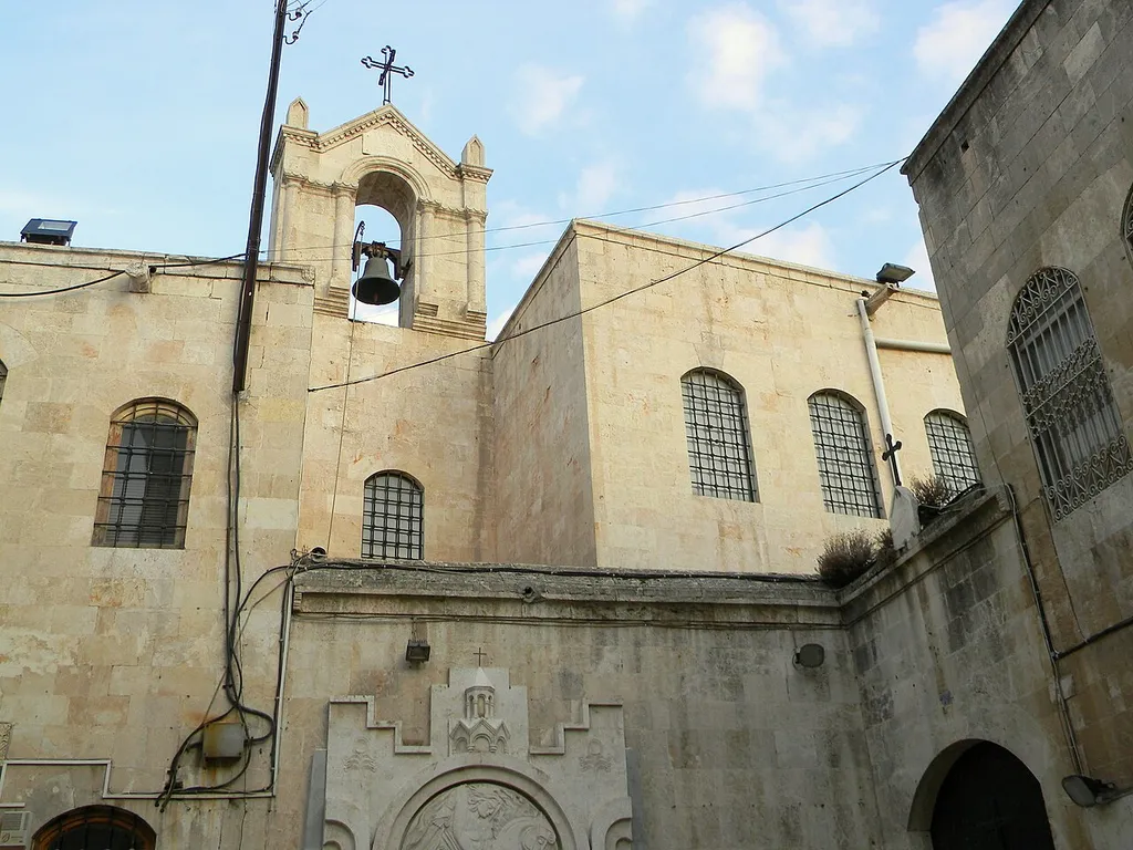 The belfry of the Greek Orthodox Church of the Dormition of Our Lady, seen from the yard of the Forty Martyrs Armenian Cathedral.