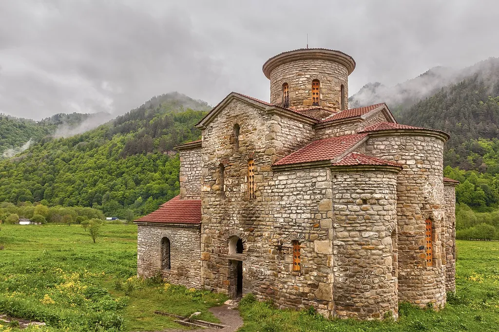Central Church of Zelenchuksky Churches under heavy sky around the ruins of Nizhnearkhyzskoe gorodishche near Arkhyz, Karachay–Cherkessia, Russian Federation