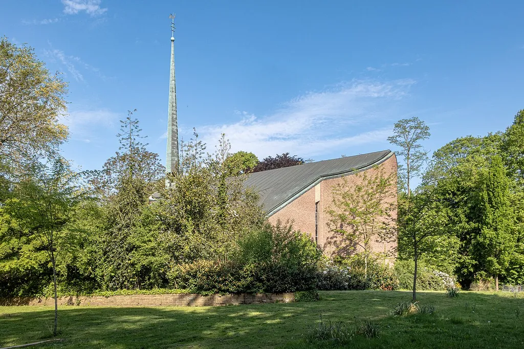 Church tower of St. Luke’s Church on the grounds of the LWL Clinic in Münster, North Rhine-Westphalia, Germany