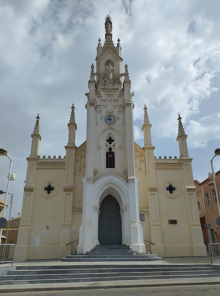 The Church of the Immaculate Heart of Mary, located in the Barrio de Peral of Cartagena (Spain), is a Roman Catholic temple consecrated in 1896. Between 1926 and 1928, the facade was redesigned under Gothic Revival parameters by the architect Víctor Beltrí.