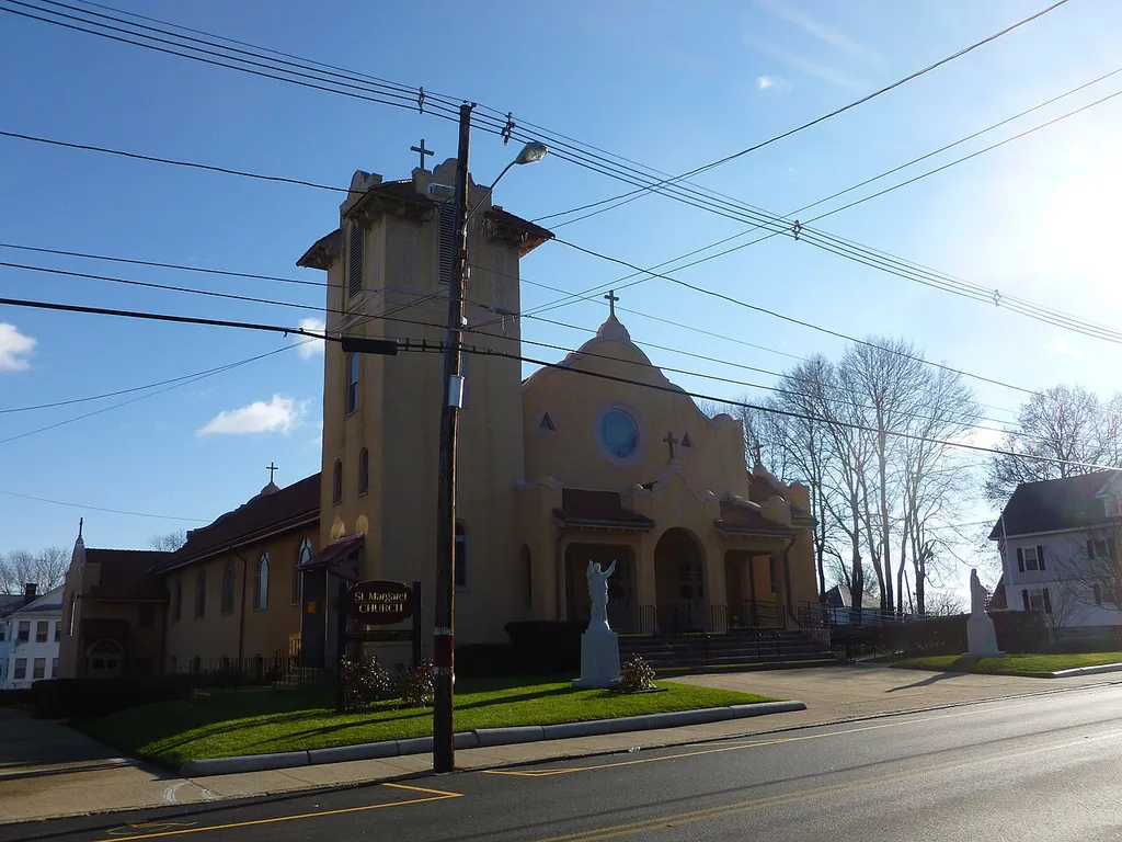 Saint Margaret's Church, located at 374 Stevens Street, Lowell, Massachusetts. North and west (front) sides of building shown. This Roman Catholic church, formally named the Parish of Saint Margaret of Scotland, was founded in 1910. More information: http://www.stmargaretlowell.org/our-history/.