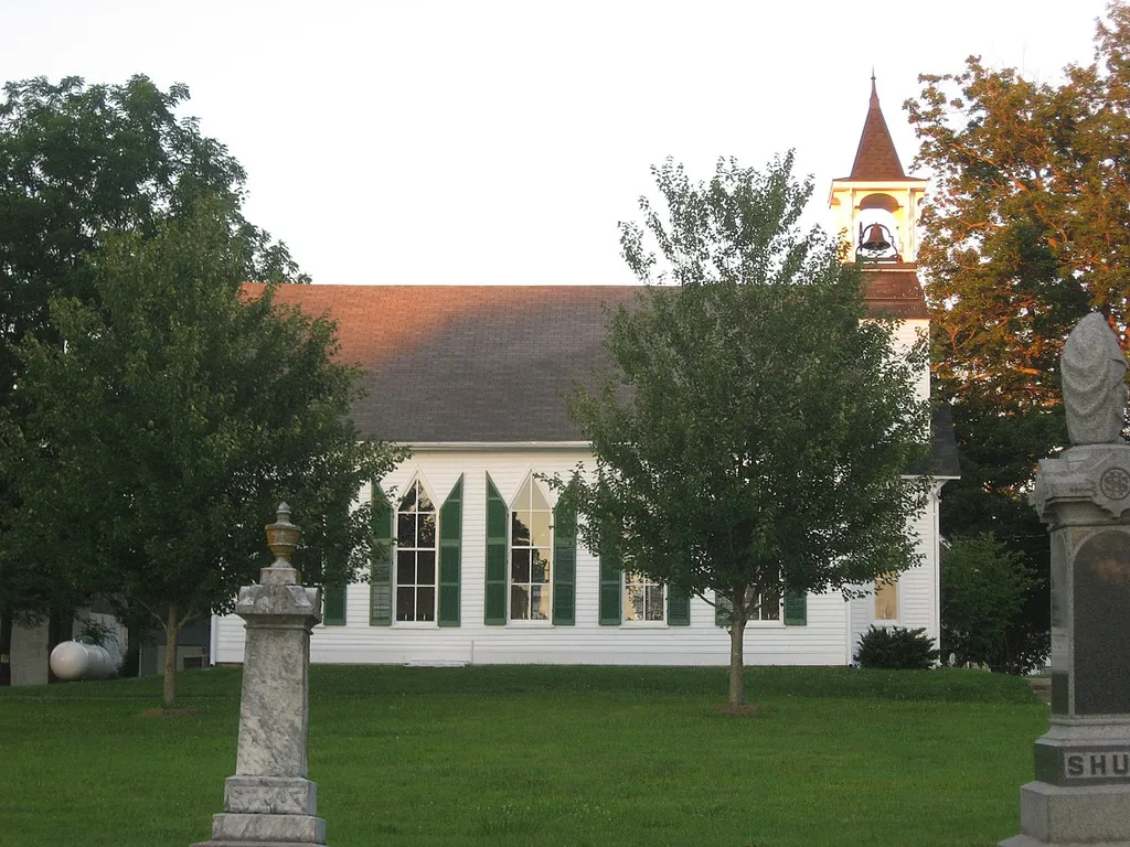 Western side of the former Poland Presbyterian Church viewed from its associated cemetery, located at 8393 E. State Road 42 in Poland, Indiana, United States. Built in 1869 and now the home of the Poland Chapel Historical Society, the church and its cemetery are listed together on the National Register of Historic Places.