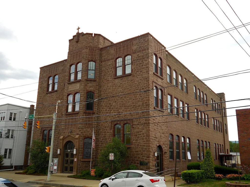 St. John the Evangelist Roman Catholic Church and School Building, on the NRHP since July 30, 2003. At 419 North Main Street, Wilkes-Barre, Luzerne County, Pennsylvania. Converted into apartments.