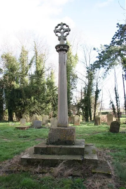Churchyard cross at St Martin's parish church, Waithe, Lincolnshire. The base is 14th-century. In 1861 the base was set on three new steps and given a new shaft and cross.