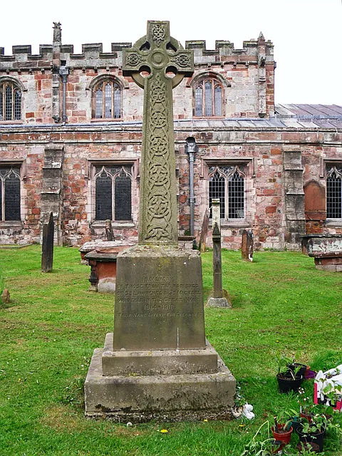The war memorial in the churchyard of St Lawrence's Church, Appleby, Cumbria, England.