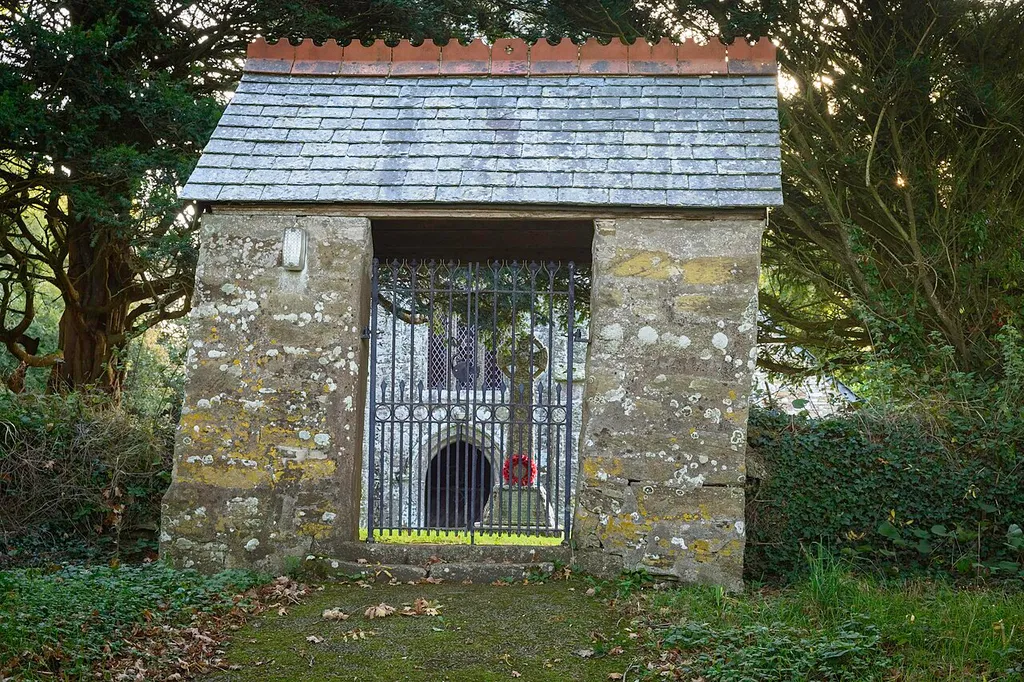 Lychgate And Churchyard Wall Along Road .mw-parser-output .messagebox{margin:4px 0;width:auto;border-collapse:collapse;border:2px solid var(--border-color-progressive,#6485d1);background-color:var(--background-color-neutral-subtle,#fbfcff);color:var(--color-base,#202122);box-sizing:border-box;border-inline-start-width:8px}.mw-parser-output .messagebox.mbox-small{font-size:88%;line-height:1.25em}.mw-parser-output .mbox-warning,.mw-parser-output .mbox-speedy{border:2px solid var(--border-color-error,#b22222);background:var(--background-color-error-subtle,#ffdbdb);border-inline-start-width:8px}.mw-parser-output .mbox-serious,.mw-parser-output .mbox-delete,.mw-parser-output .mbox-stop{border:2px solid var(--border-color-error,#b22222);border-inline-start-width:8px}.mw-parser-output .mbox-issue,.mw-parser-output .mbox-content{border:2px solid #f28500;background:var(--background-color-warning-subtle,#ffe);border-inline-start-width:8px}.mw-parser-output .mbox-query,.mw-parser-output .mbox-style{border:2px solid #f4c430;background:var(--background-color-warning-subtle,#ffe);border-inline-start-width:8px}.mw-parser-output .mbox-shit{border:2px solid #960;border-inline-start-width:8px}.mw-parser-output .mbox-license{border:2px solid #88a;border-inline-start-width:initial}.mw-parser-output .mbox-legal{border:2px solid var(--border-color-notice,#666);background:var(--background-color-base,#fff);border-inline-start-width:8px}.mw-parser-output .mbox-honor{border:2px solid #ca3;background:var(--background-color-warning-subtle,#fcf4db);border-inline-start-width:8px}.mw-parser-output .mbox-growth{border:2px solid #8d4;background:var(--background-color-success-subtle,#d5fdf4);border-inline-start-width:8px}.mw-parser-output .mbox-move{border:2px solid #93c;border-inline-start-width:8px}.mw-parser-output .mbox-protection,.mw-parser-output .mbox-message{border:2px solid var(--border-color-base,#aaa);border-inline-start-width:8px}.mw-parser-output .messagebox .mbox-text{border:none;paddi