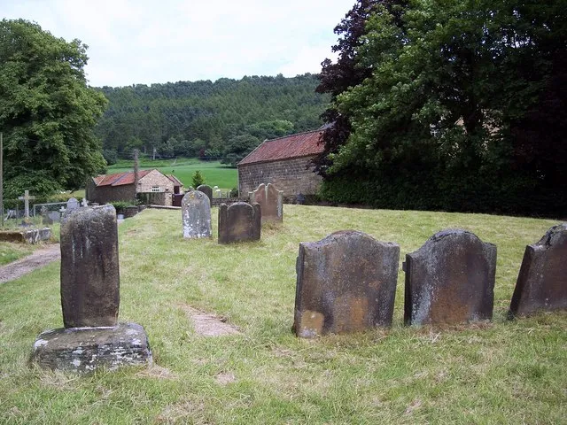 The Church of St Wilfrid, Kirby Knowle - Churchyard The remains of a fine old boundary cross stands in the churchyard, but some say it is the stump of a pre-conquest cross.