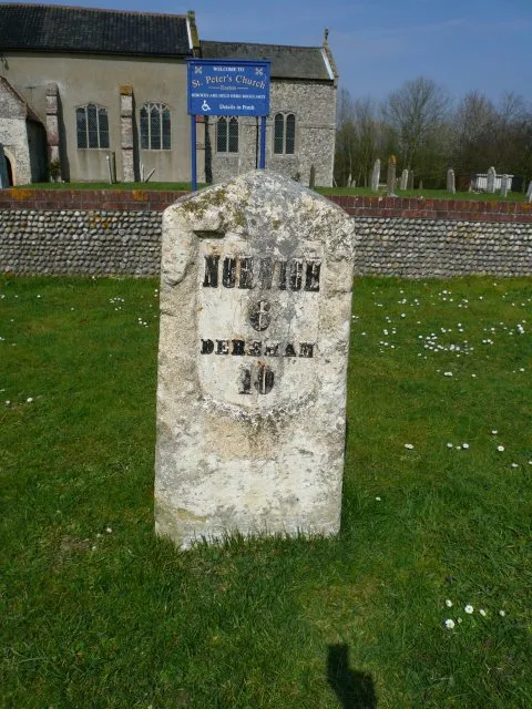 Milestone Milestone (Norwich 6, Dereham 10) on the side of the old A47 near St Peter's Church, Easton, Norfolk