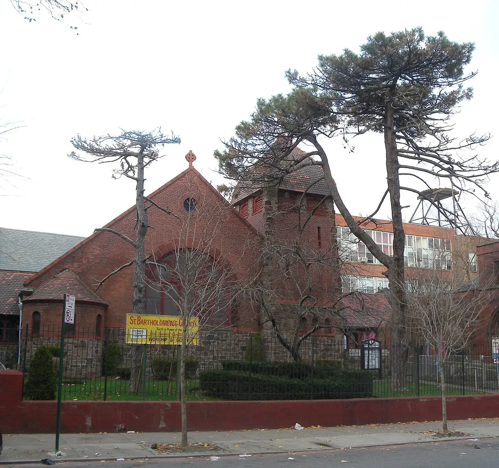 Looking north across Pacific Street at St Bartholemew Episcopal Church on a mostly cloudy afternoon.