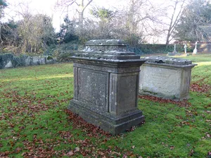 Group of 2 monuments in the churchyard approximately 8 metres south west of porch to Church of St John the Baptist