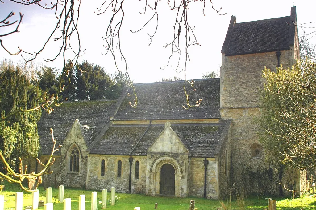 St Laurence's parish church, Caversfield, Oxfordshire, seen from the north. Lower left are graves of airmen from RAF Bicester who died in the Second World War