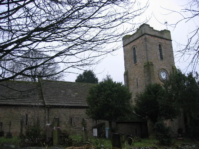 Ebchester Church. Ebchester Church shown from wall to left of main gates. Tower building shown on the right and attached sub buildings on the left. Small selection of graves also in shot and marked for reclamation.