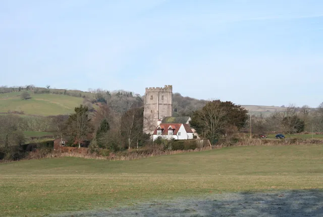 View across a field at Stawley, Somerset, to the parish church of St Michael and All Angels
