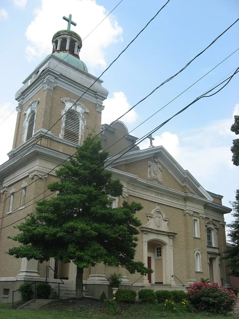 Front and western side of St. George's Catholic Church, located at 1809 Standard Avenue in Louisville, Kentucky, United States. Built in 1909, it is listed on the National Register of Historic Places.