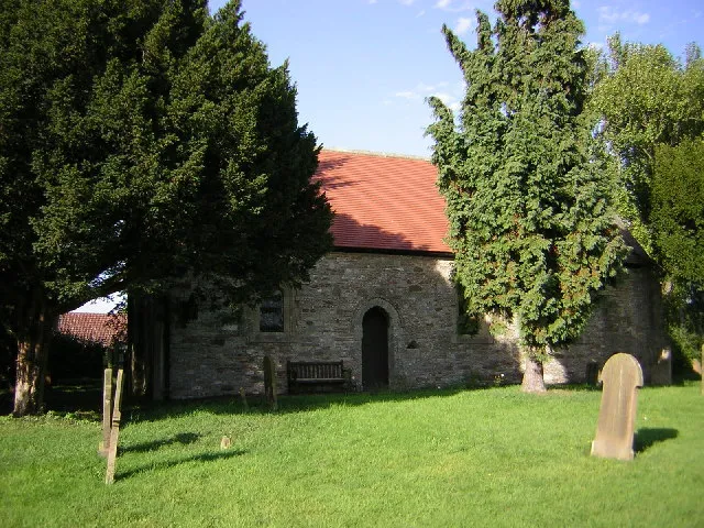 St.Paul's church, West Drayton, Notts. Tiny nave and chancel all in one. The south door is much decayed but obviously Norman with a holy water stoup to the right.