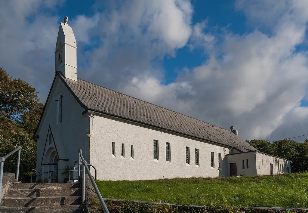 North-west view of St. Joseph's Church, Letterfrack, built in 1925/6 after the designs by the architect Rudolf Maximilian Butler, and dedicated on 12 June 1926 by Thomas Gilmartin. (See NIAH record, DIA entry, and Dedication of Letterfrack Church, Connacht Tribune, 26 June 1926, p. 3.)
