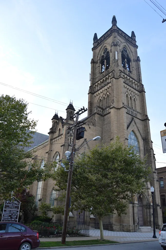 Southern side and front of St. Stephen's Catholic Church, located at 1930 W. Fifty-fourth Street in Cleveland, Ohio, United States. Built in 1875, it is listed on the National Register of Historic Places.