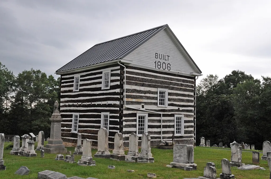 THE CHURCH WAS BUILT BY MEMBERS OF THE REFORMED AND LUTHERAN CHURCHES IN 1806. IT WAS USED BY BOTH CONGREGATIONS UNTIL 1843, AND THEN BY THE REFORMED CONGREGATION UNTIL 1853. THE FIRST BURIAL IN THE CEMETERY WAS IN 1806, WHILE THE CHURCH WAS BEING CONSTRUCTED. THE CHURCH WAS ORIGINALLY BUILT OF LOGS AND IN 1881 COVERED WITH WEATHERBOARDING. THE WEATHERBOARDING WAS REMOVED IN 1935, AND THE CHURCH WAS RESTORED IN THE EARLY 2000S