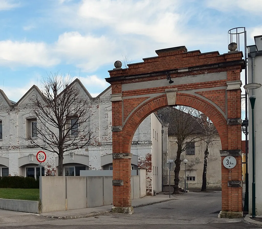 Remainders of the former factory in the Nadelburg, Lichtenwörth, Lower Austria. Today, only two walls of the factory do exist, in between a residential building. To the right the second remaining city gate (of three) - the other one is the Adlertor (eagle gate).