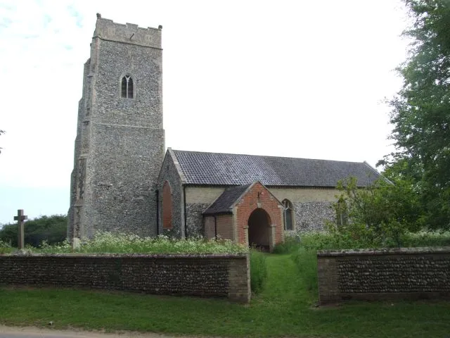 St Michael's parish church, Benacre, Suffolk, England, seen from the southwest. The cross in the left is the parish War Memorial.