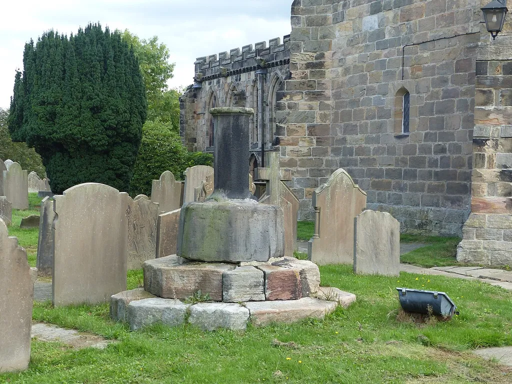 Grade II listed building and scheduled monument in Astbury, Cheshire. Listed as "Cross base and shaft in Churchyard of St. Mary". .mw-parser-output .messagebox{margin:4px 0;width:auto;border-collapse:collapse;border:2px solid var(--border-color-progressive,#6485d1);background-color:var(--background-color-neutral-subtle,#fbfcff);color:var(--color-base,#202122);box-sizing:border-box;border-inline-start-width:8px}.mw-parser-output .messagebox.mbox-small{font-size:88%;line-height:1.25em}.mw-parser-output .mbox-warning,.mw-parser-output .mbox-speedy{border:2px solid var(--border-color-error,#b22222);background:var(--background-color-error-subtle,#ffdbdb);border-inline-start-width:8px}.mw-parser-output .mbox-serious,.mw-parser-output .mbox-delete,.mw-parser-output .mbox-stop{border:2px solid var(--border-color-error,#b22222);border-inline-start-width:8px}.mw-parser-output .mbox-issue,.mw-parser-output .mbox-content{border:2px solid #f28500;background:var(--background-color-warning-subtle,#ffe);border-inline-start-width:8px}.mw-parser-output .mbox-query,.mw-parser-output .mbox-style{border:2px solid #f4c430;background:var(--background-color-warning-subtle,#ffe);border-inline-start-width:8px}.mw-parser-output .mbox-shit{border:2px solid #960;border-inline-start-width:8px}.mw-parser-output .mbox-license{border:2px solid #88a;border-inline-start-width:initial}.mw-parser-output .mbox-legal{border:2px solid var(--border-color-notice,#666);background:var(--background-color-base,#fff);border-inline-start-width:8px}.mw-parser-output .mbox-honor{border:2px solid #ca3;background:var(--background-color-warning-subtle,#fcf4db);border-inline-start-width:8px}.mw-parser-output .mbox-growth{border:2px solid #8d4;background:var(--background-color-success-subtle,#d5fdf4);border-inline-start-width:8px}.mw-parser-output .mbox-move{border:2px solid #93c;border-inline-start-width:8px}.mw-parser-output .mbox-protection,.mw-parser-output .mbox-message{border:2px solid var(--border-color-base,#aaa