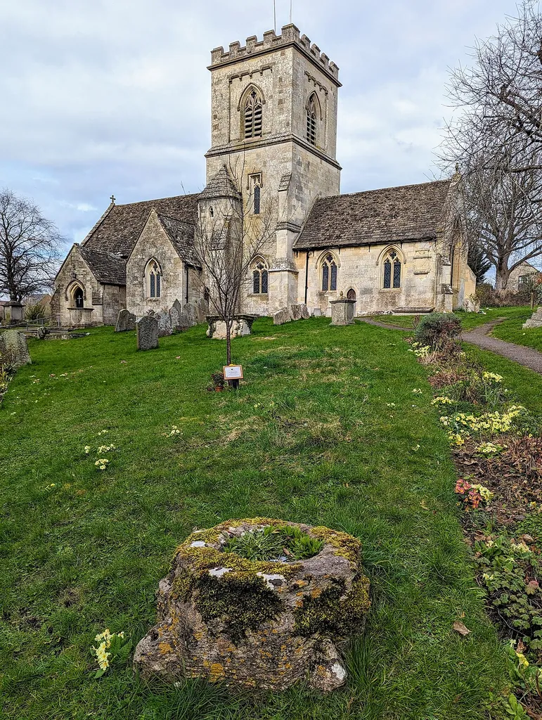 Cross shaft base in the churchyard of St George church in Brockworth, Gloucester, England.