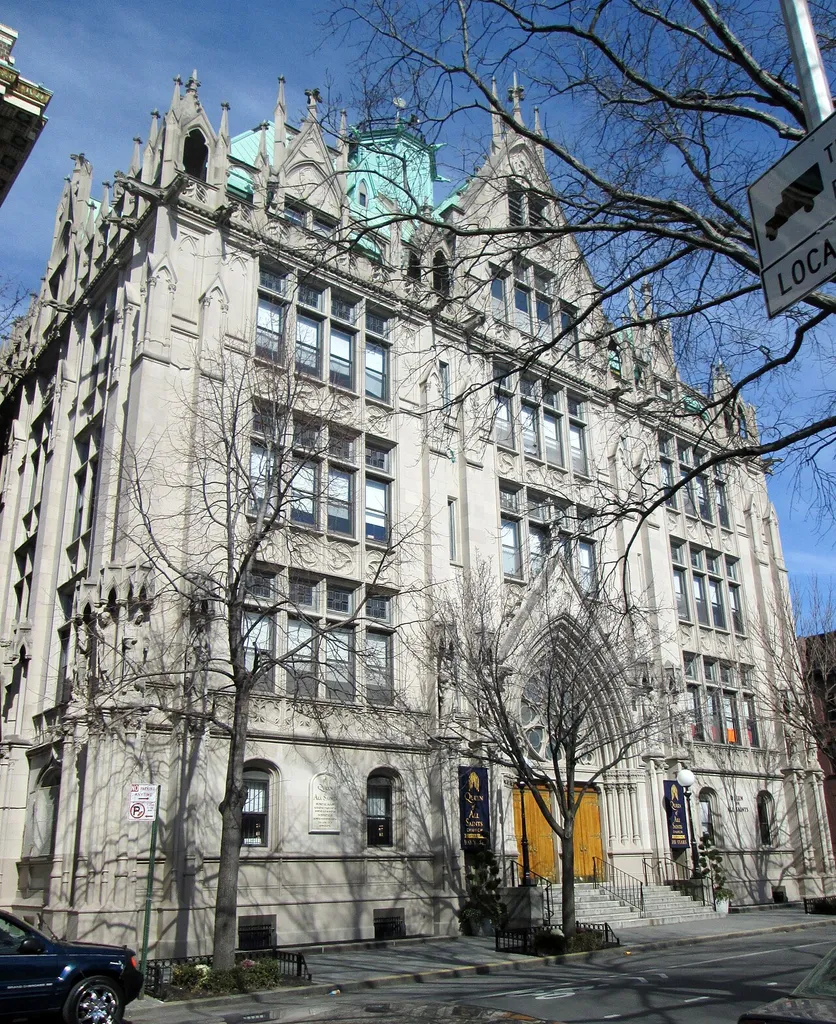 The Queen of All Saints Roman Catholic Church at 300 Vanderbilt Avenue on the corner of Lafayette Avenue in the Fort Greene neighborhood of Brooklyn, New York City was built in 1910-13 and was designed in the Gothic Revival style by Reiley &amp; Steinback. The church's school was built at the same time, but the apse of the church and the rectory weren't built until 1915. The parish dates from 1879 and was originally called St. John's Parish. The church is located within the Fort Greene Historic District. (Source: "Fort Greene Historic District Designation Report")